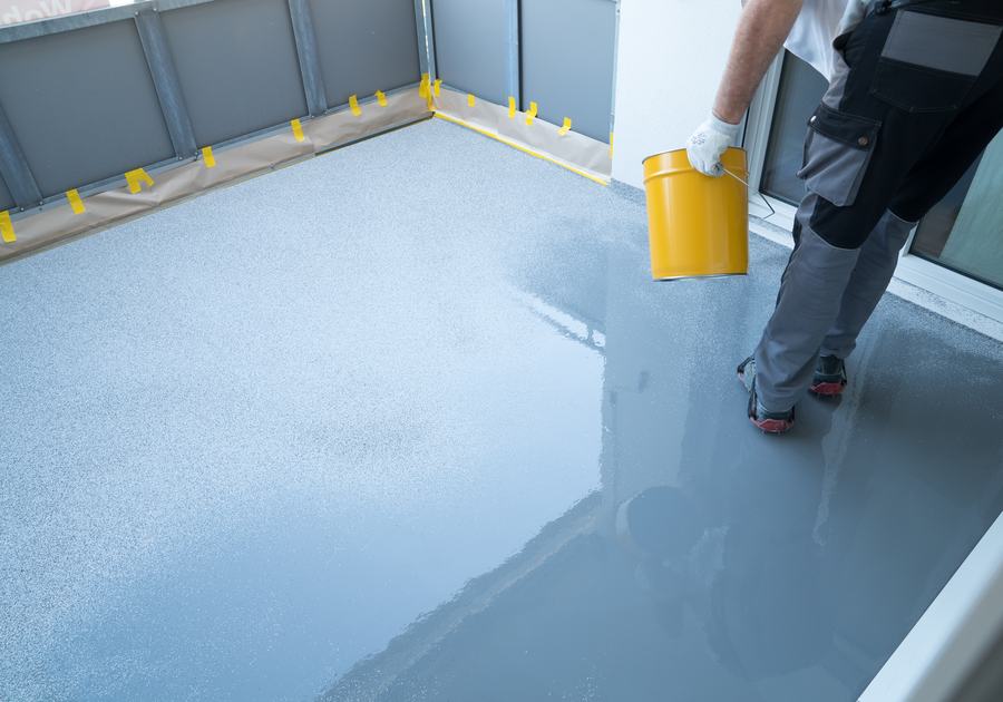 Applying a waterproof resin coating to a balcony floor